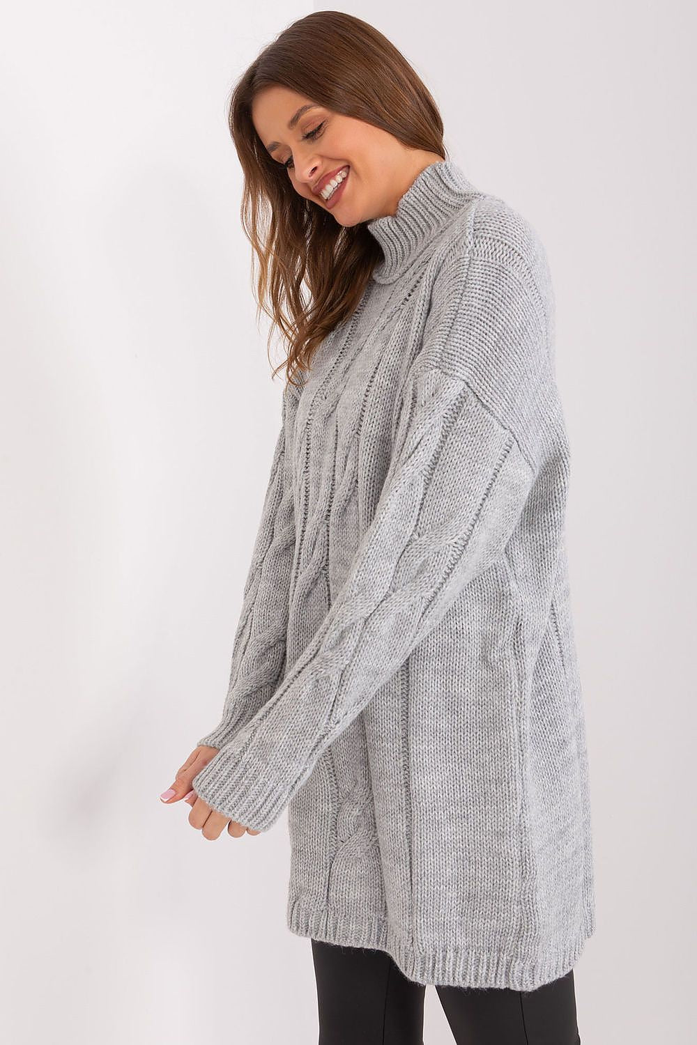 Side view of turtleneck dress styled with ankle boots for an everyday chic look in grey