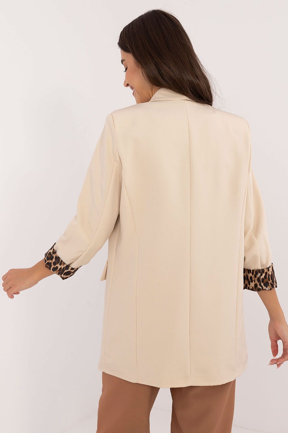 Back view of Elise beige jacket showing standard length and classic cut.
