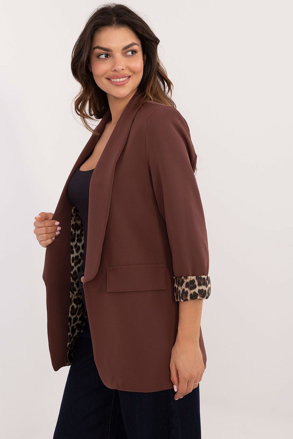 Side view showing smooth fabric and long sleeves of brown Elise jacket.