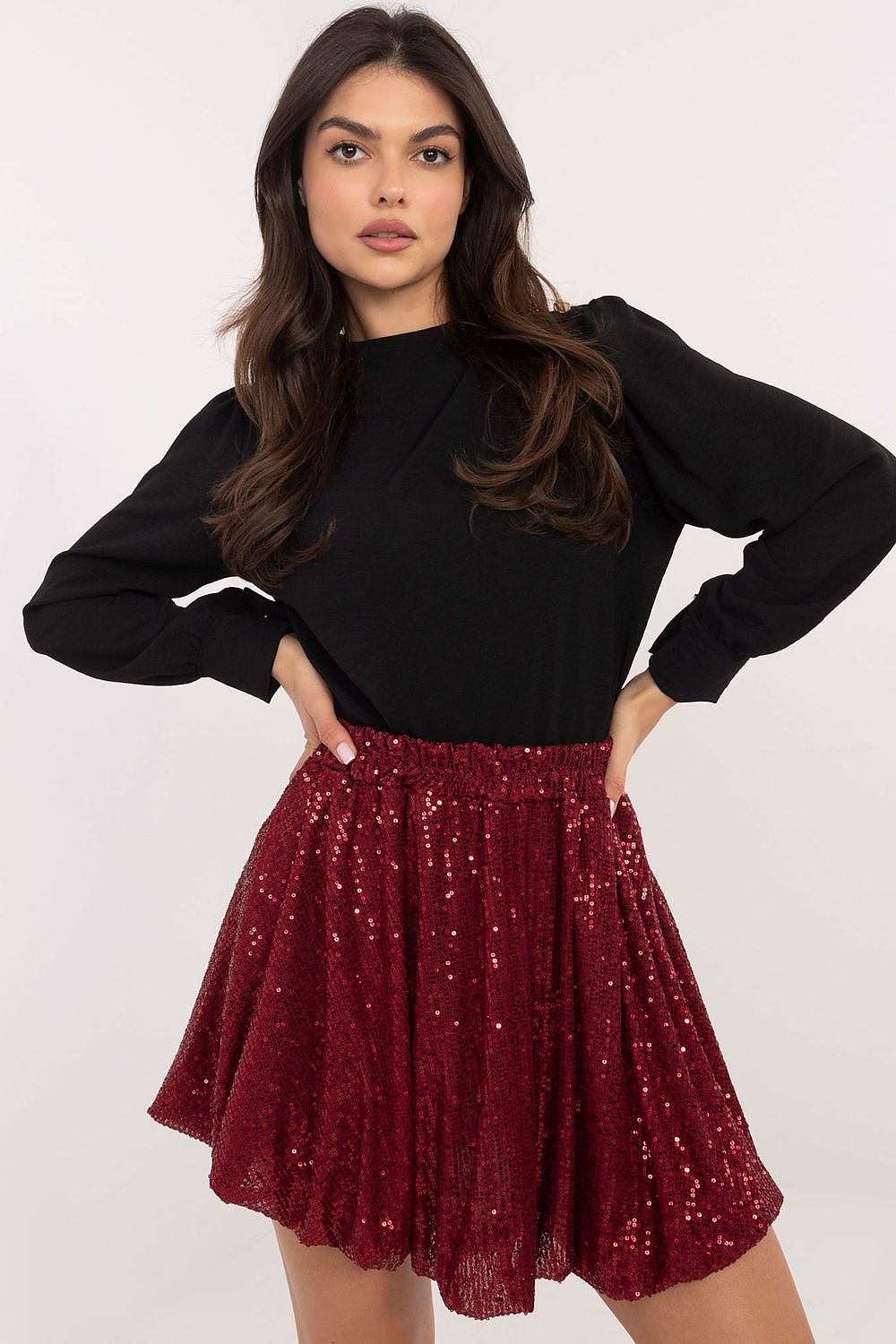 Close-up of sequin bomb mini skirt showcasing shimmering fabric and modern design.