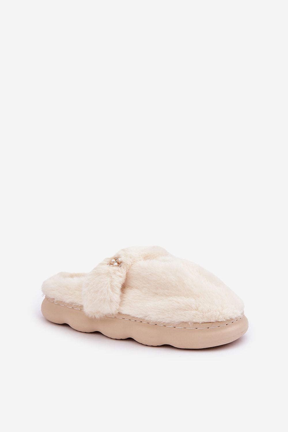 White fuzzy slippers on a white background