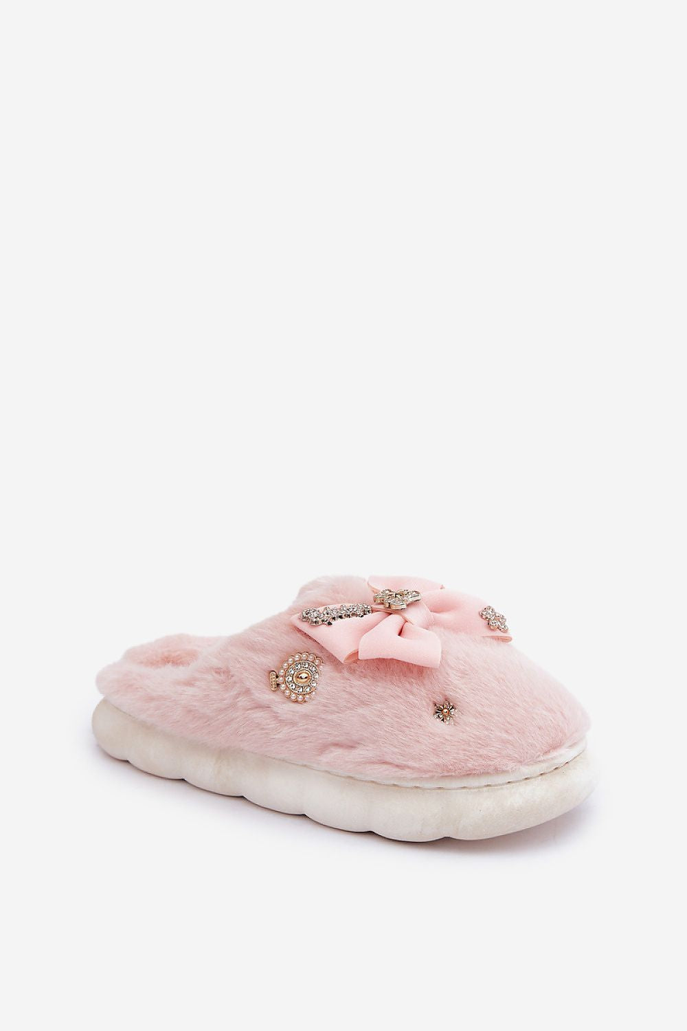 Pink slipper with decorative bow and embellishments on a white background