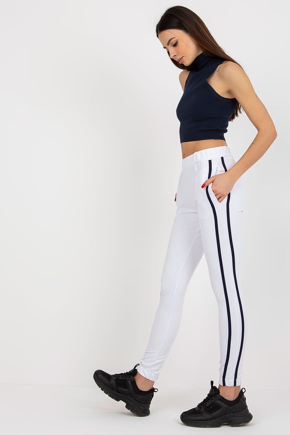 “White Stripey Tracksuit Trousers, side view showing elastic waistband”