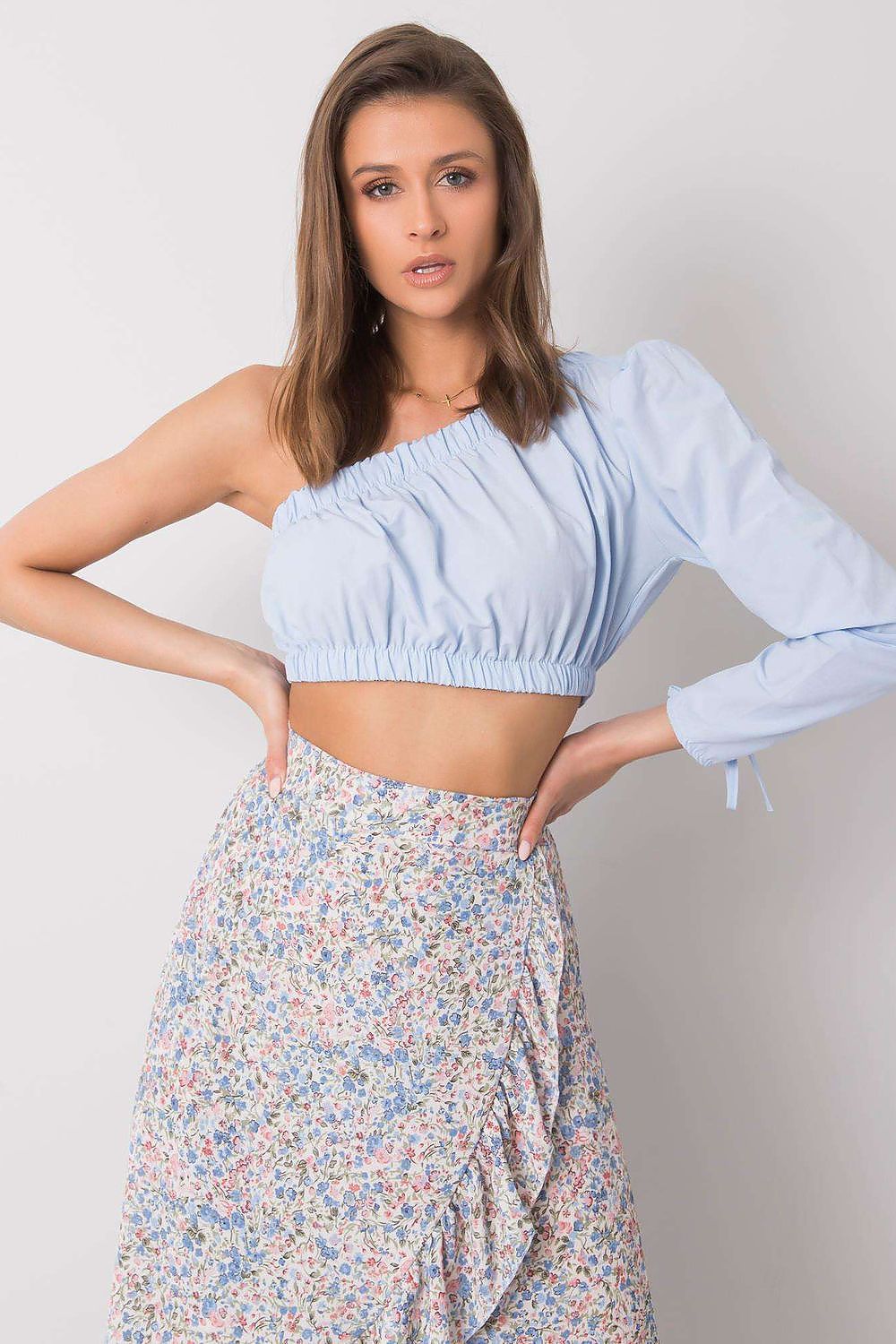 “Blue Asym One-Sleeve Blouse, front view with tie detail”