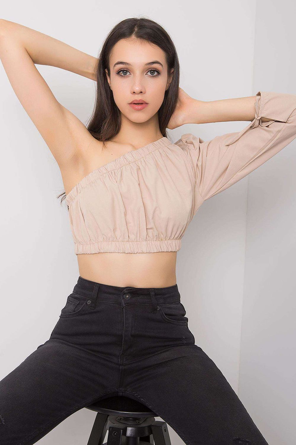 “Beige Asym One-Sleeve Blouse, angled view of sleeve detail”
