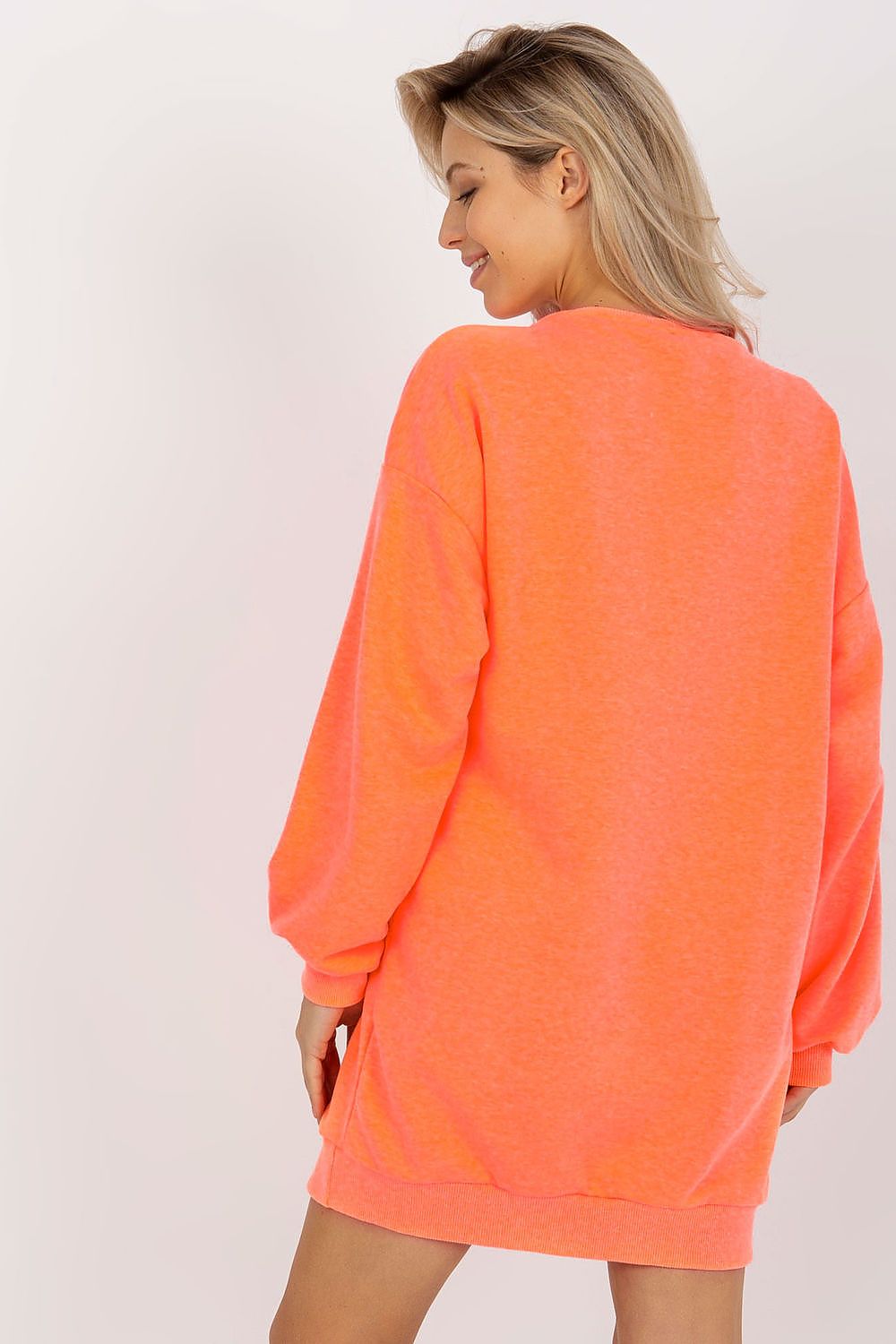 “Urban Ease Longline Sweatshirt in Orange, back view”