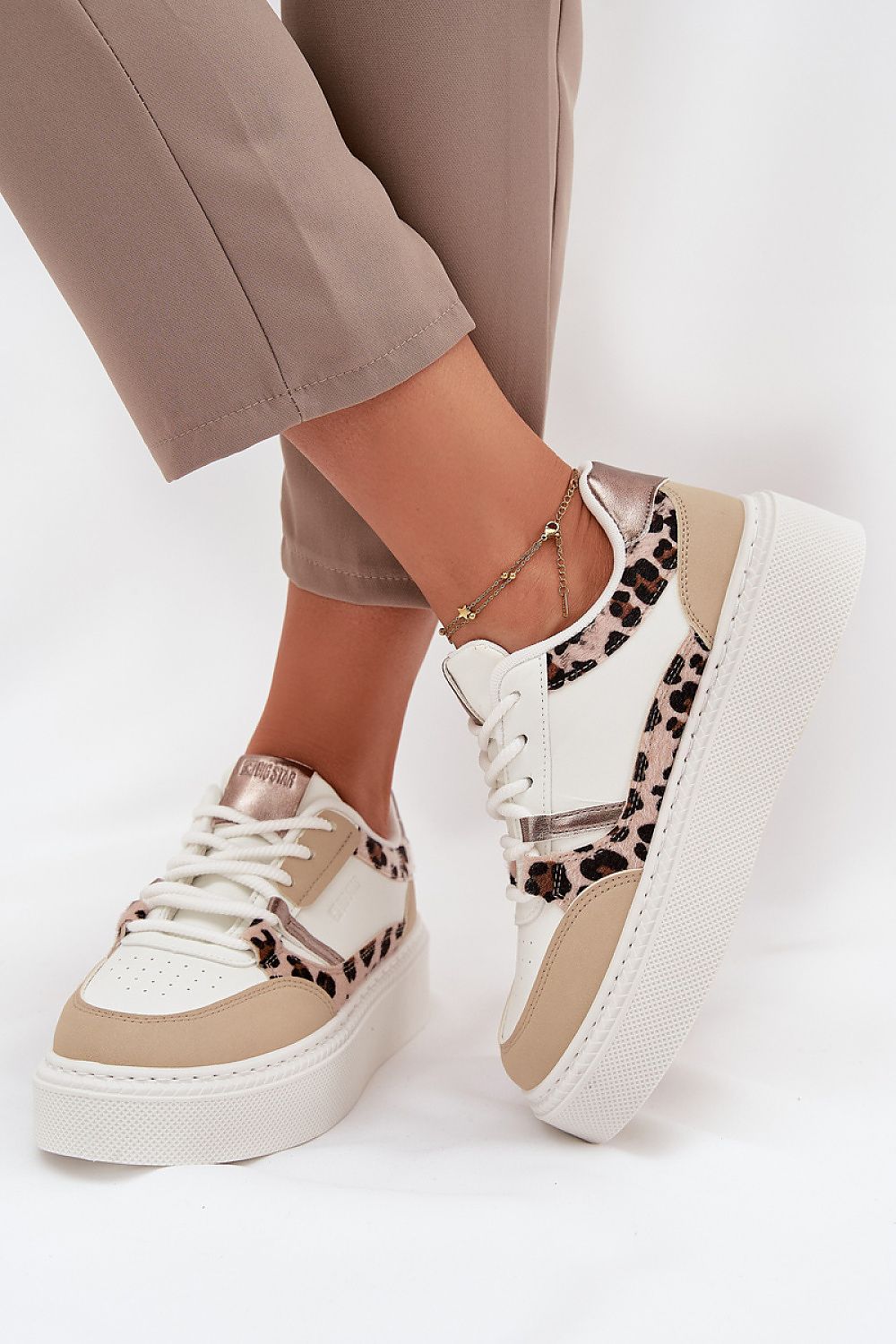 Side view – White 2 laced women’s sneakers showing smooth texture.