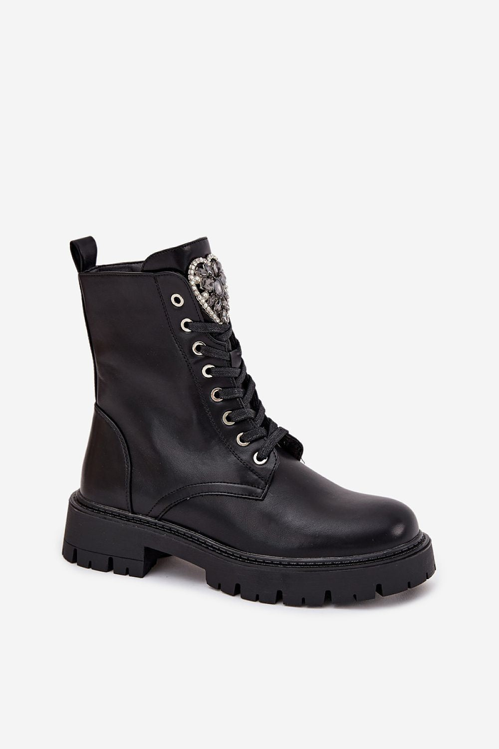 Close-up of warm blanket lining inside black eco-leather ankle boots.