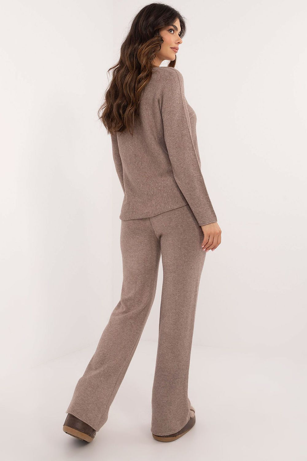 Soft knit sweater and pants set for women in casual style – flat lay.