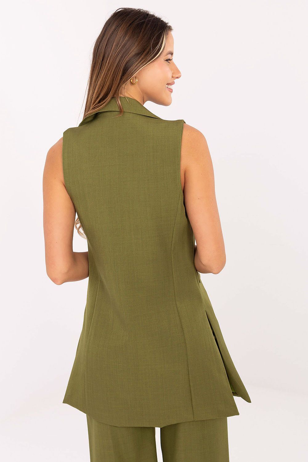 Back view of green sleeveless tailored vest showing elegant silhouette.