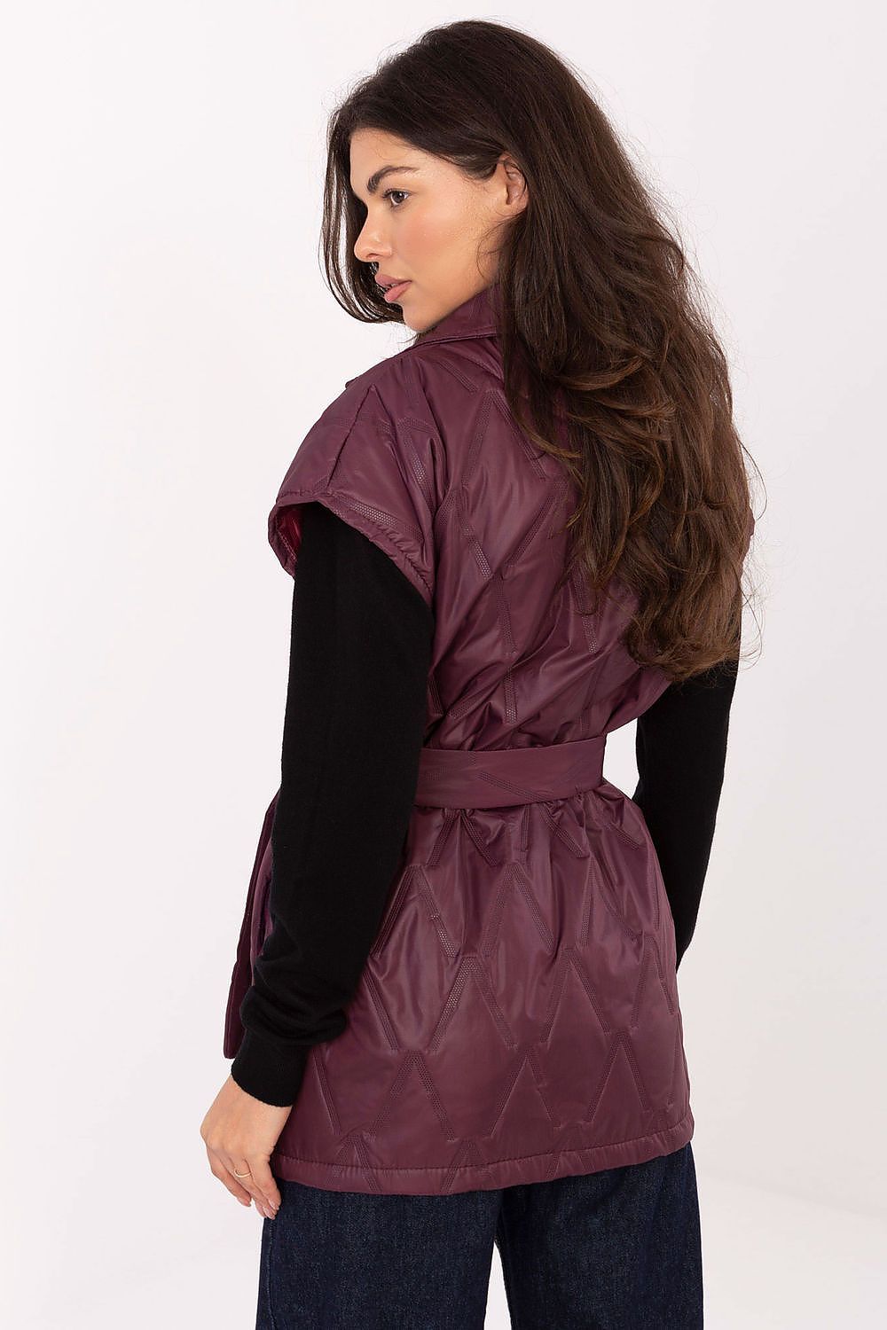 Back view of Elara vest in deep red showing feminine silhouette and stylish details.