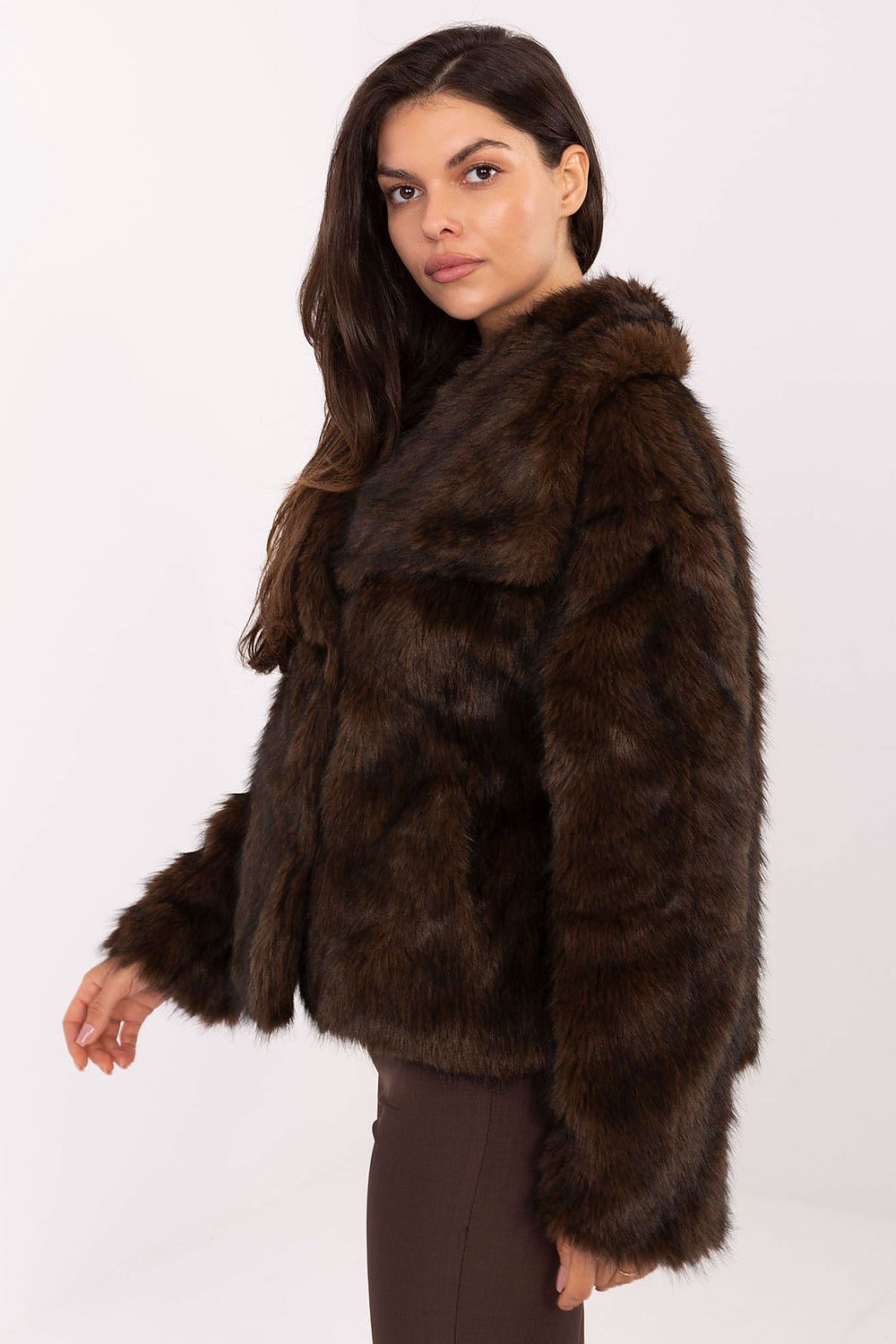 Side view highlighting textured fabric and slip pockets of Celeste Women’s fur coat.