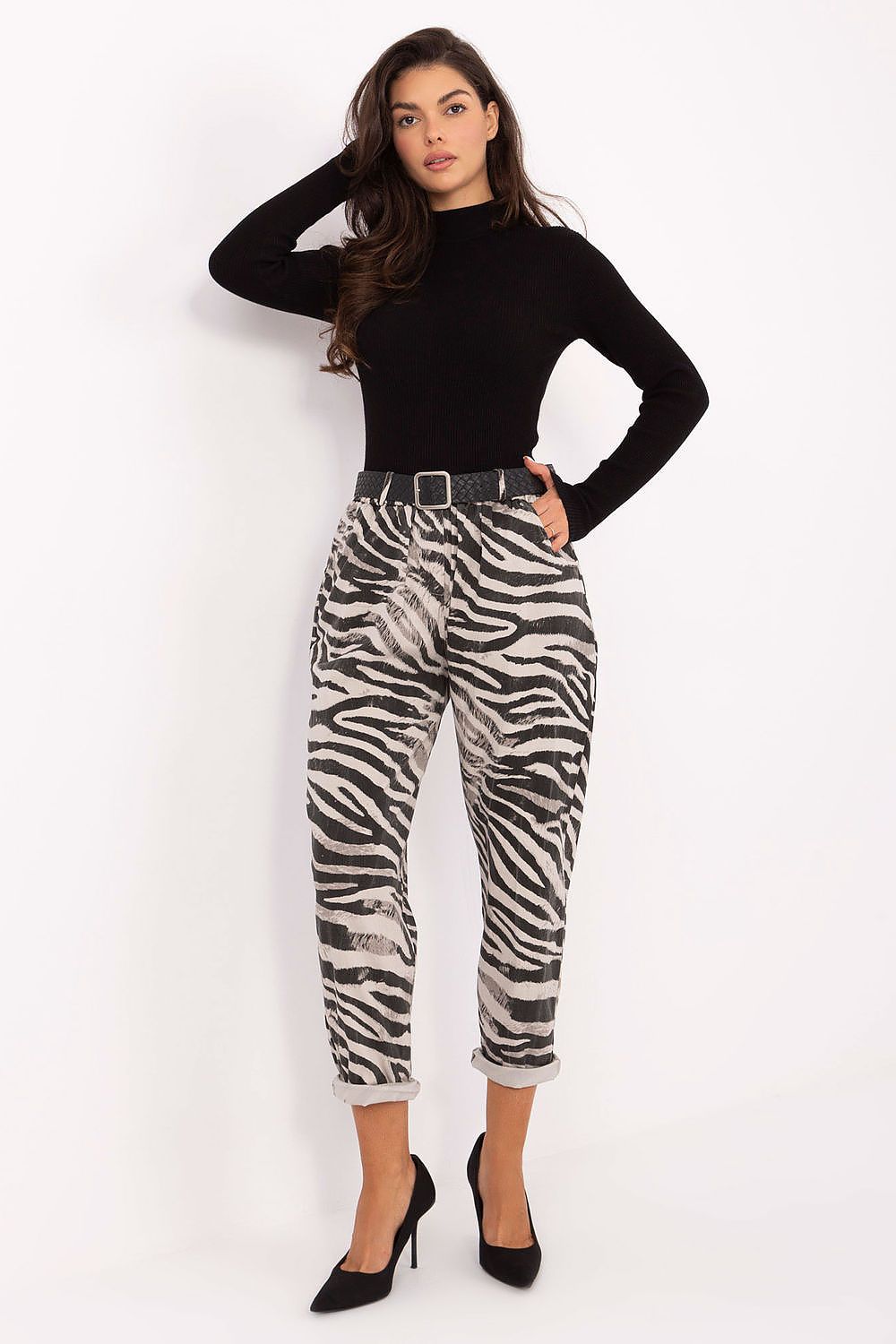 Women’s zebra print tapered trousers with high waist and buttoned belt.