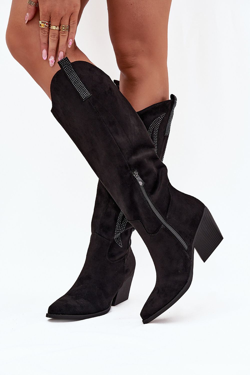 Side view highlighting knee-high shaft, zipper closure, and decorative details of Arden black boots.