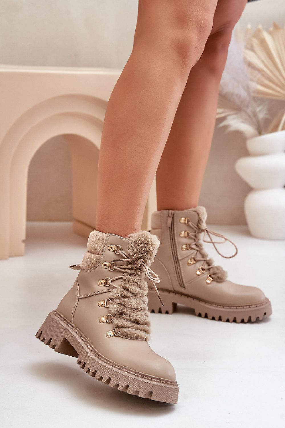 Side view of beige eco leather ankle boots with zipper and laces