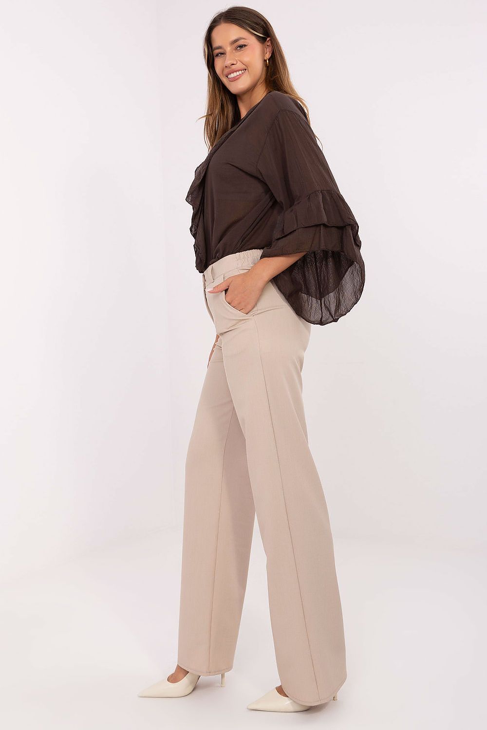 Side view of elegant women's material trousers with pockets