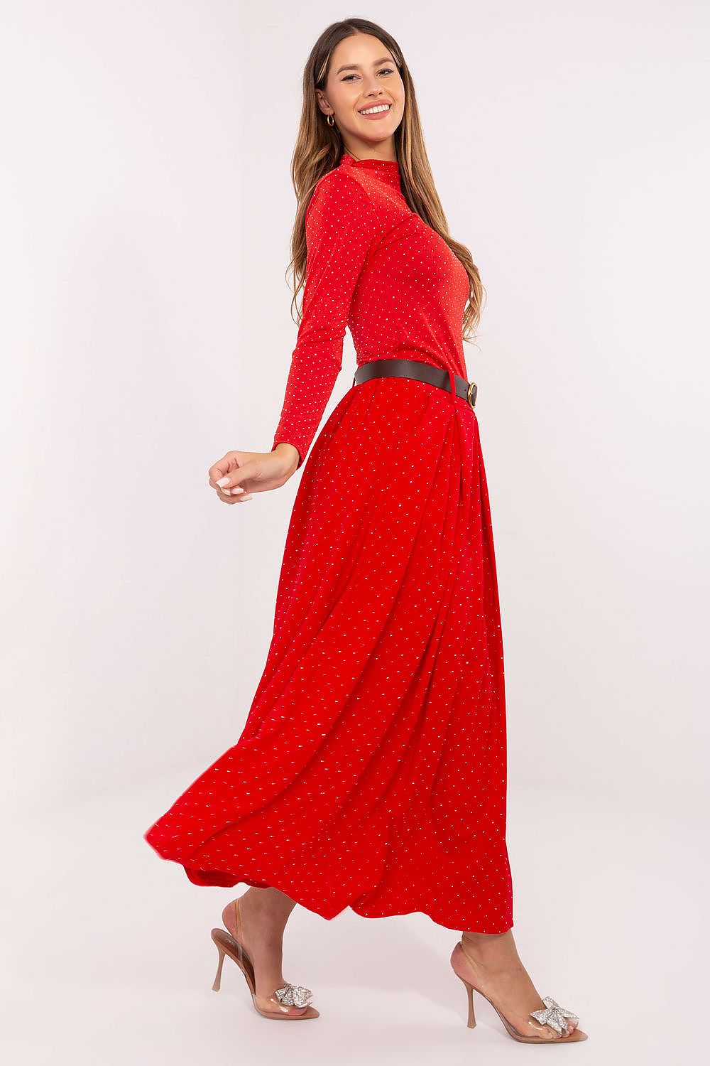 Side view of studded maxi skirt showing elegant shine and flowy silhouette.