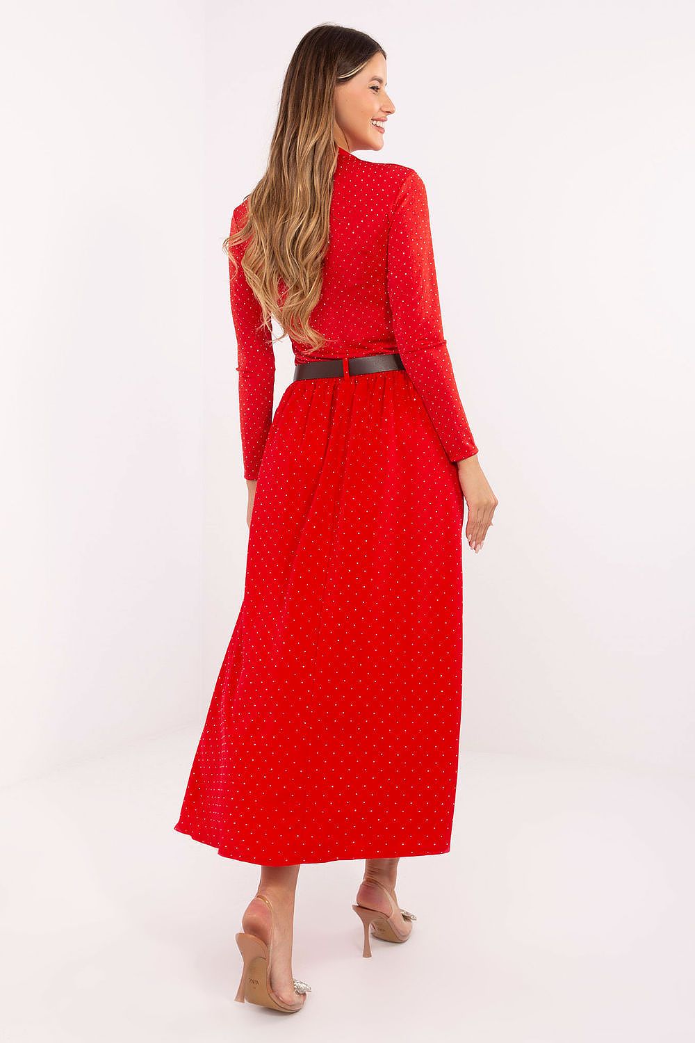 Close-up of waistband and decorative studs on the elegant maxi skirt.