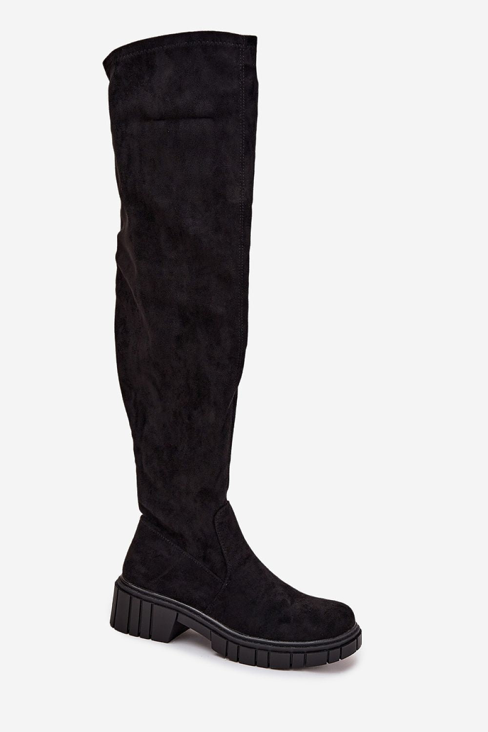 Angled view showing the tall silhouette and soft eco suede texture perfect for winter outfits.