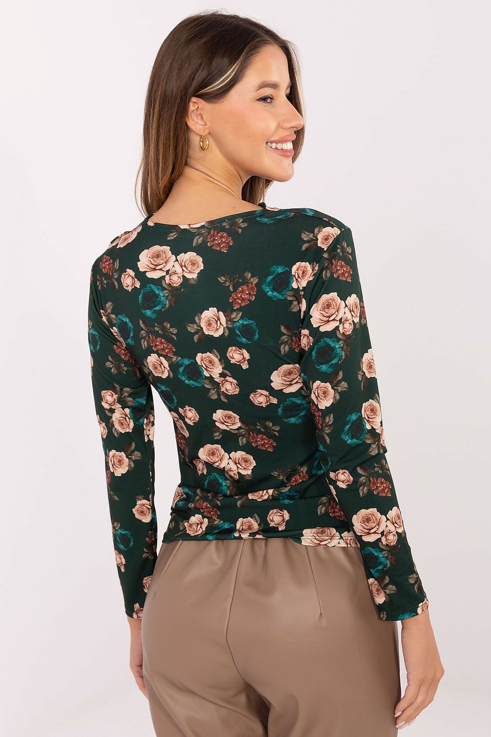 Green elegant floral blouse – back view showing smooth and timeless finish.