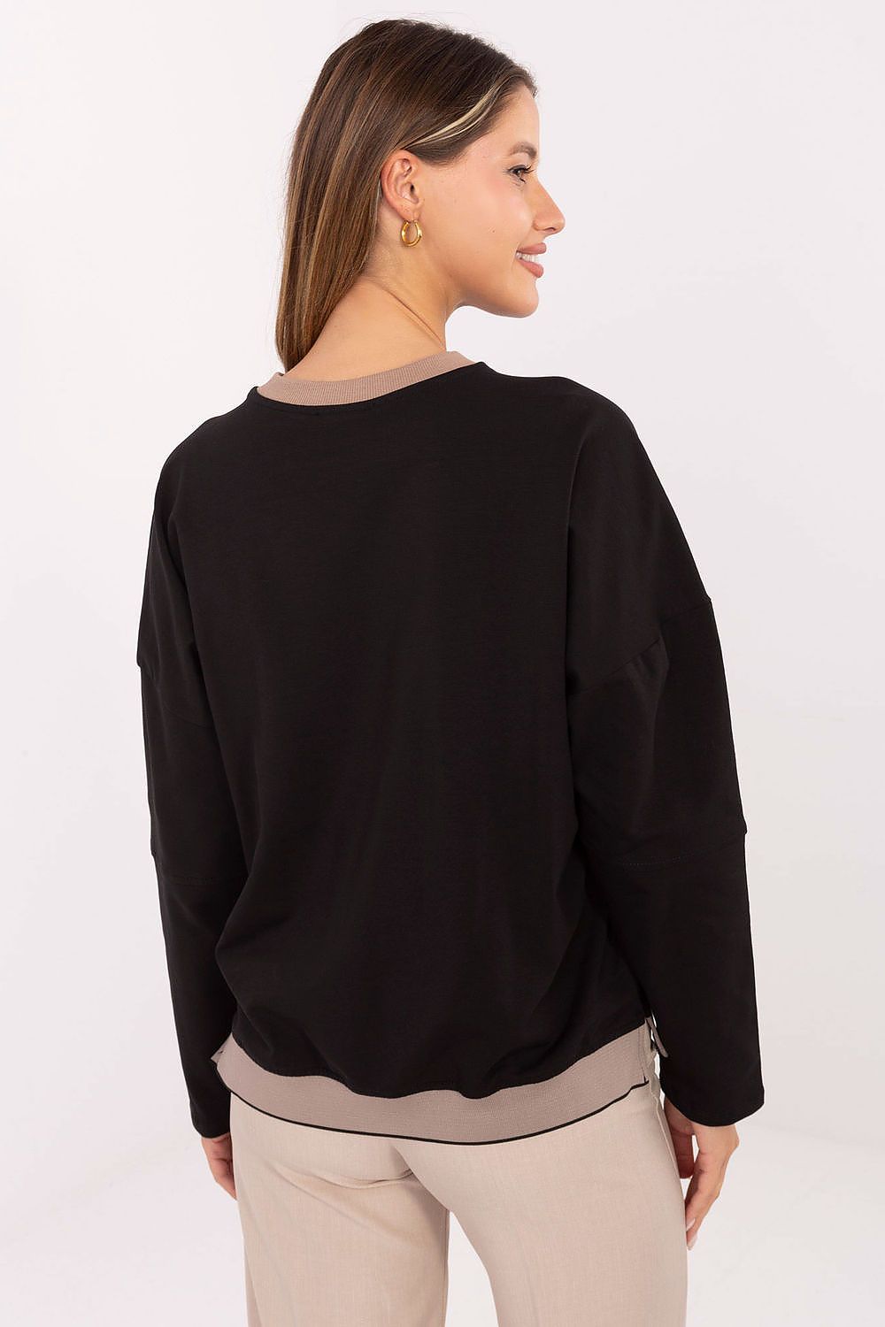 Model wearing black sweatshirt, illustrating comfort and casual fashion