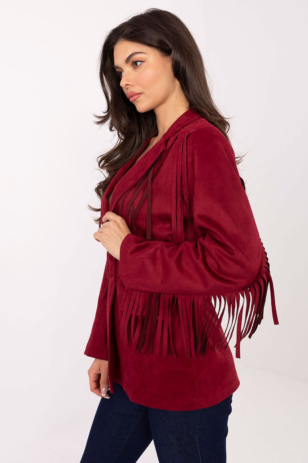 Side view of suede fringed blazer showing sleeve and waist details in red