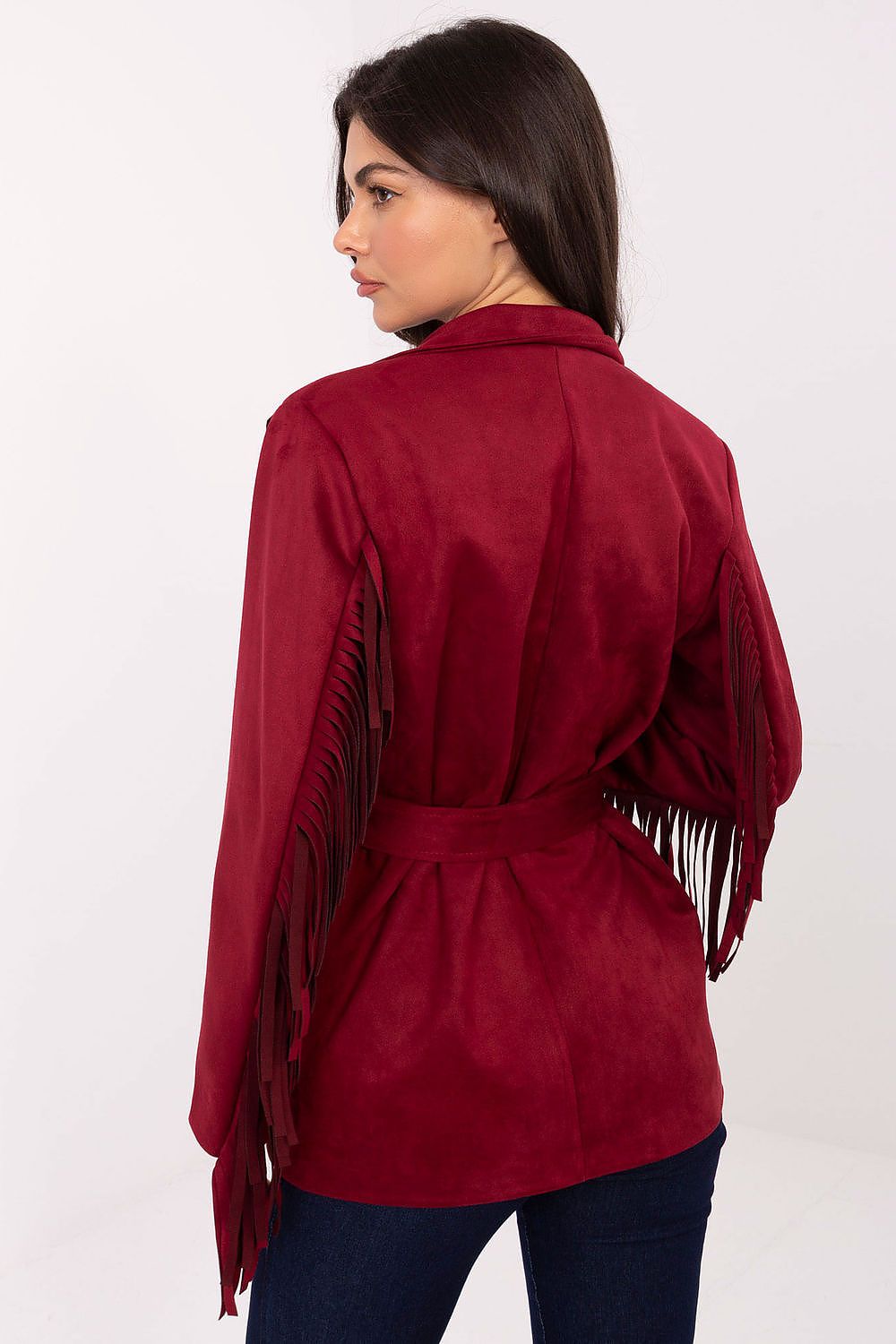 Close-up of blazer fringe and button closure details in red