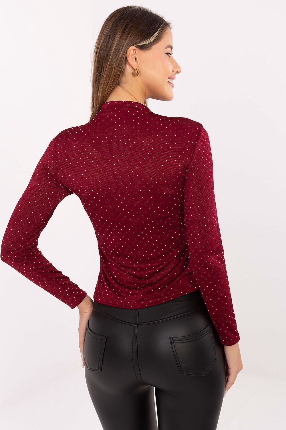Subtle sequin women’s top paired with elegant trousers