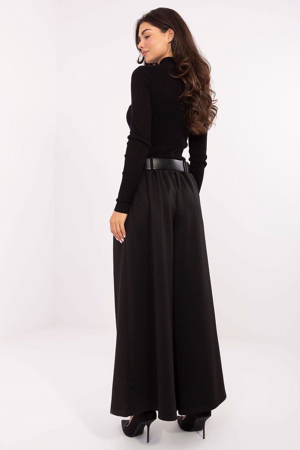 Back close-up of waistline with fastened belt and decorative pleats in black