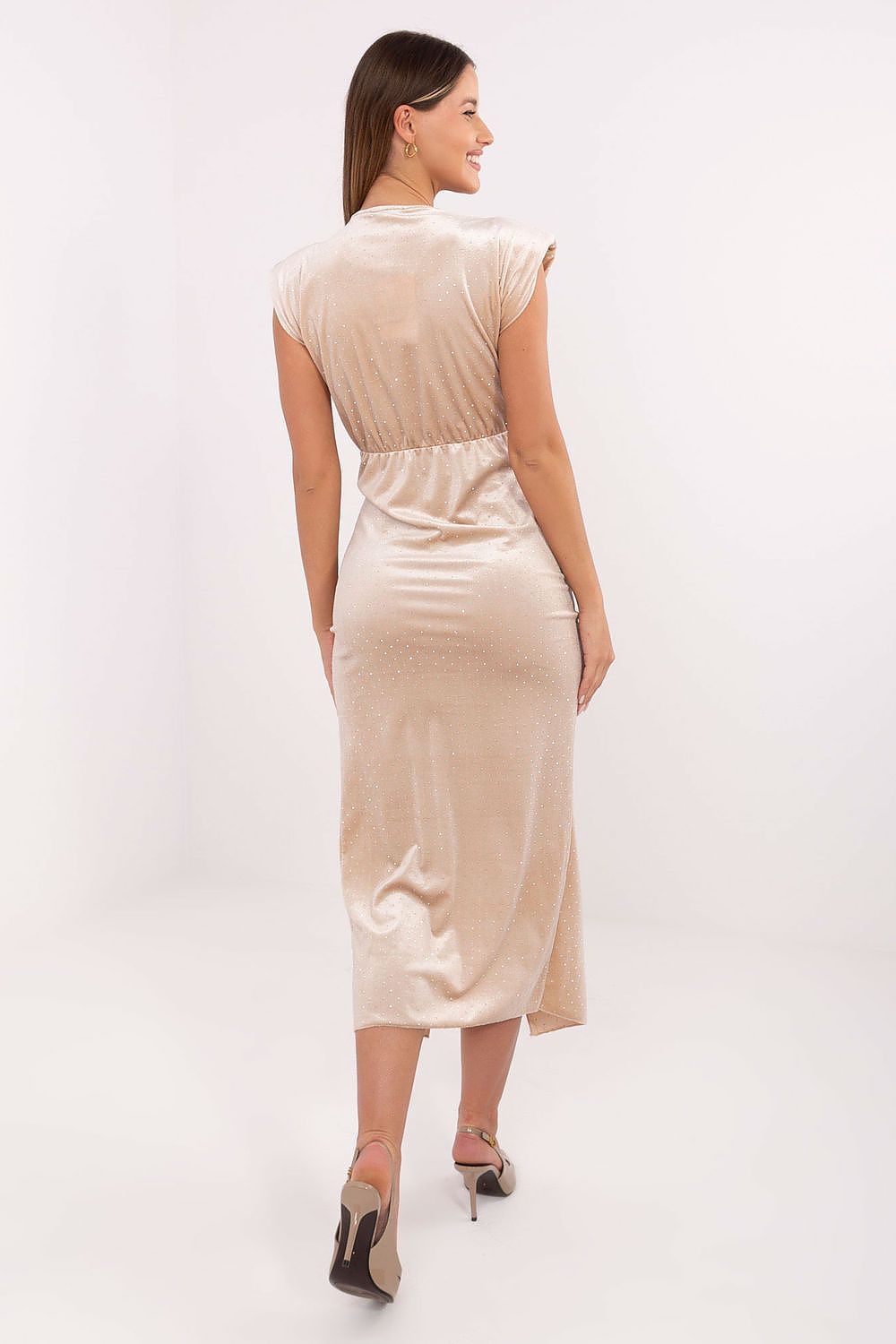 “Beige fitted dress with metal waist decoration and pleats”