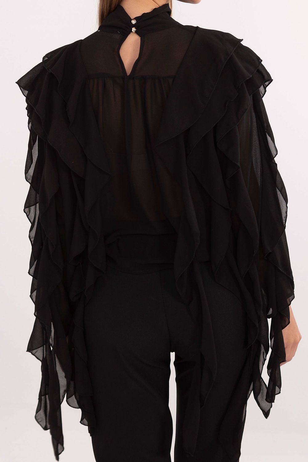 Black ruffled blouse with a plain background