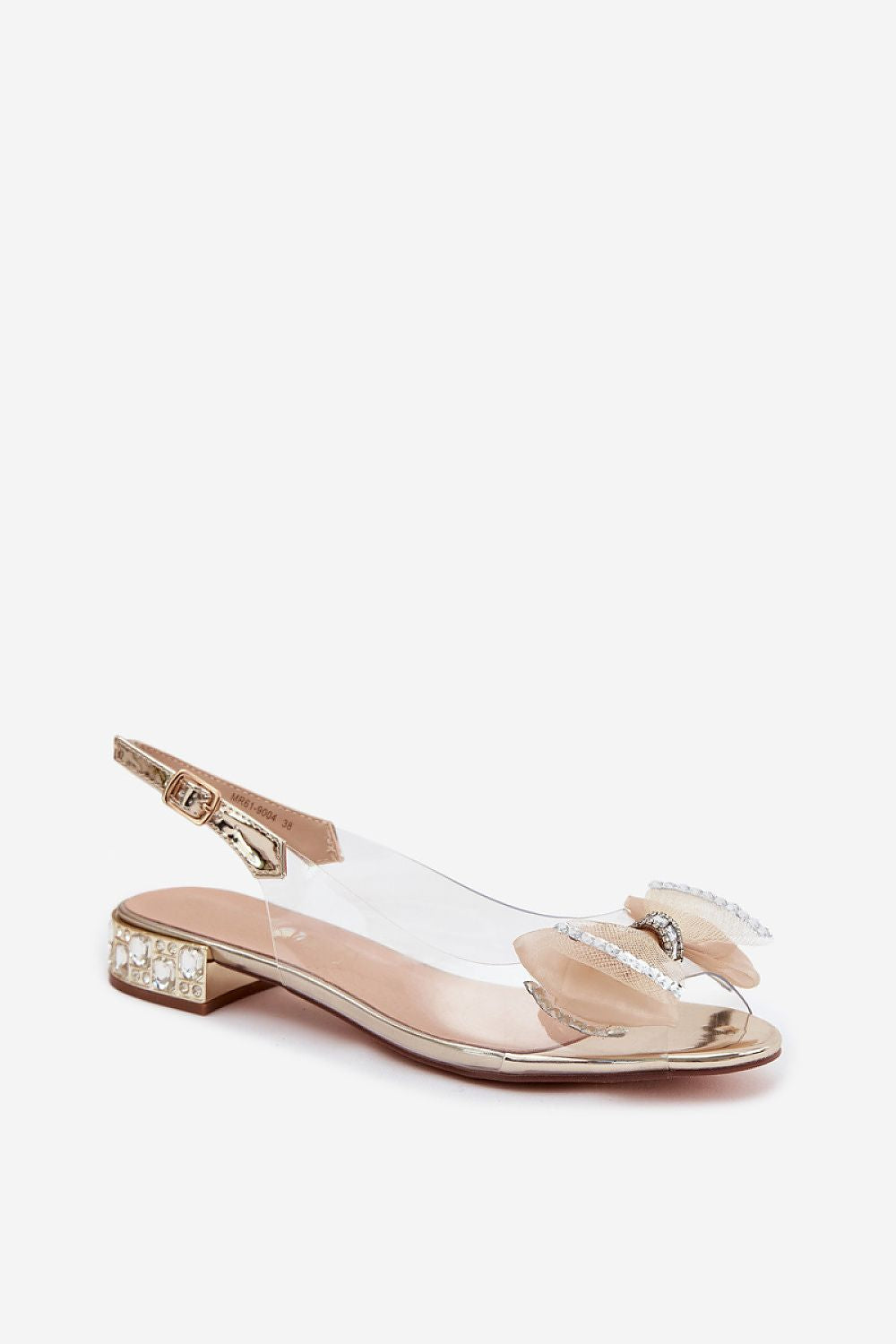 Clear sandal with gold embellishments on a white background