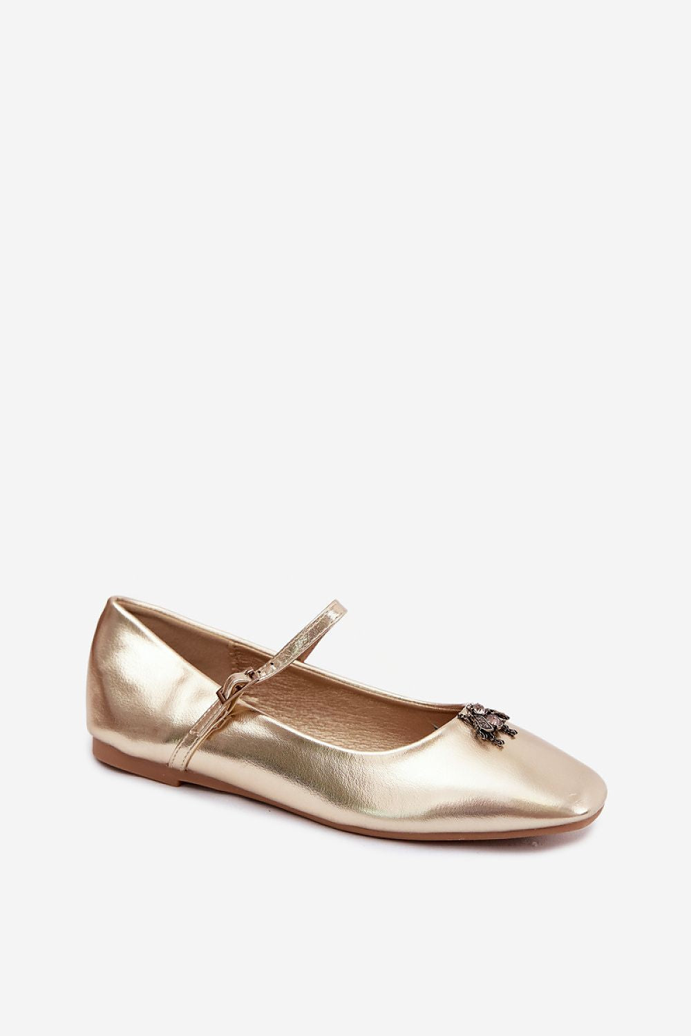 Gold ballet flat shoe on a white background
