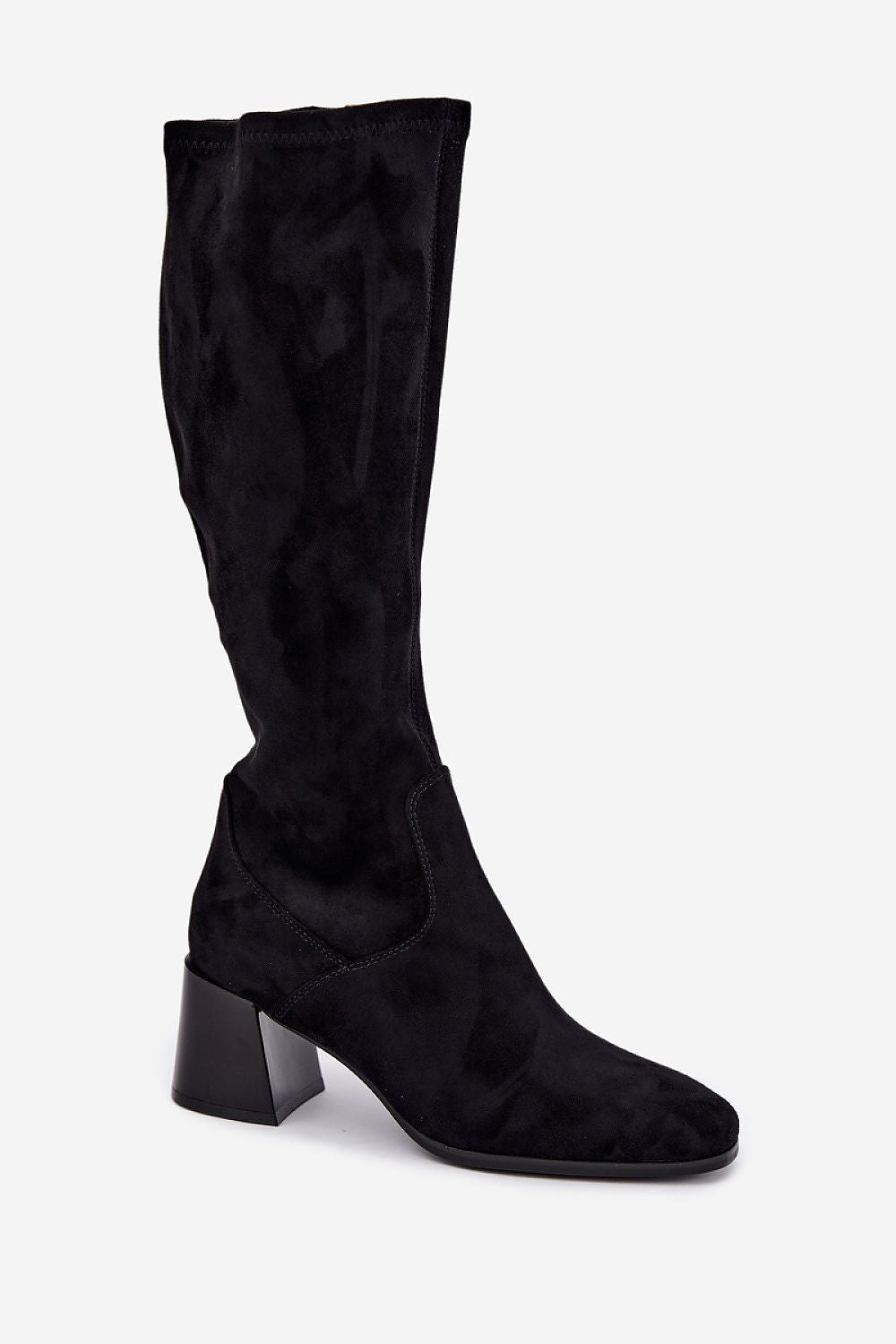A single black suede knee-high boot with a block heel, shown from a three-quarters angle against a plain light gray background.