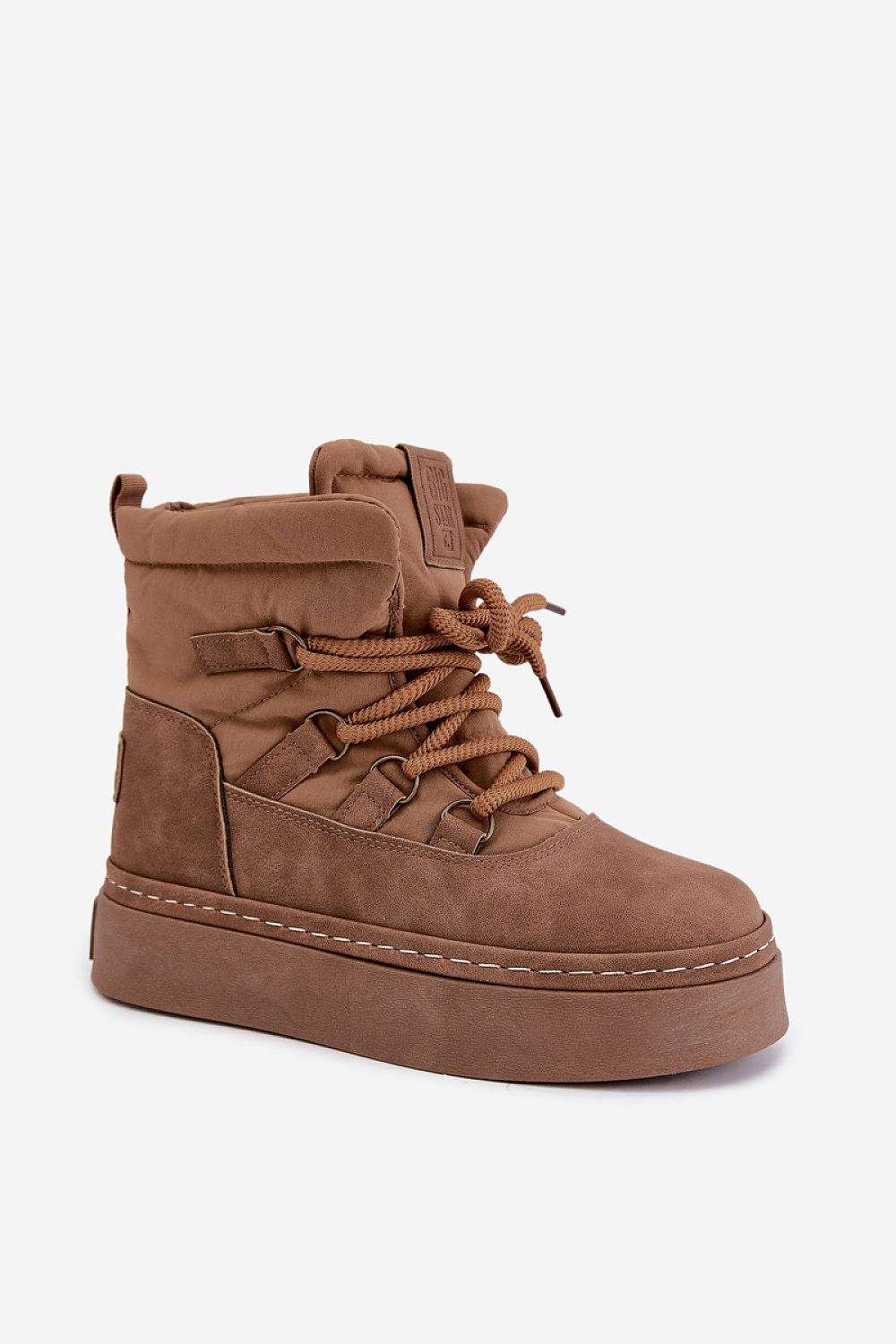 A brown suede-like ankle boot with matching laces, a thick platform sole, and decorative strap details, shown on a light gray background.