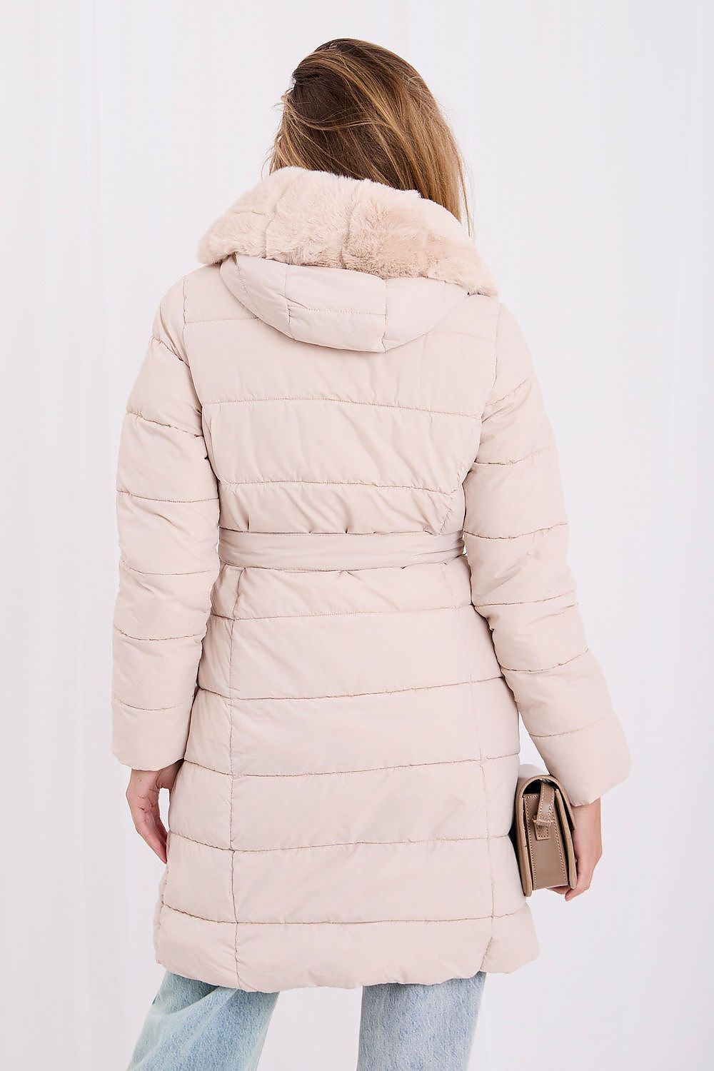 Women's beige knee-length quilted coat with hood, detachable fur trim and waist belt rear view