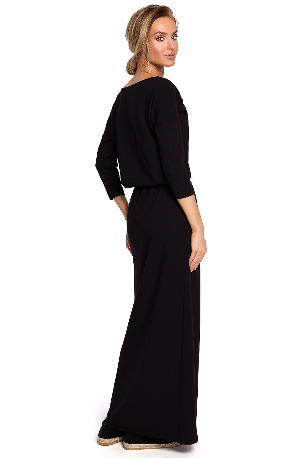 Woman wearing a black dress on a white background