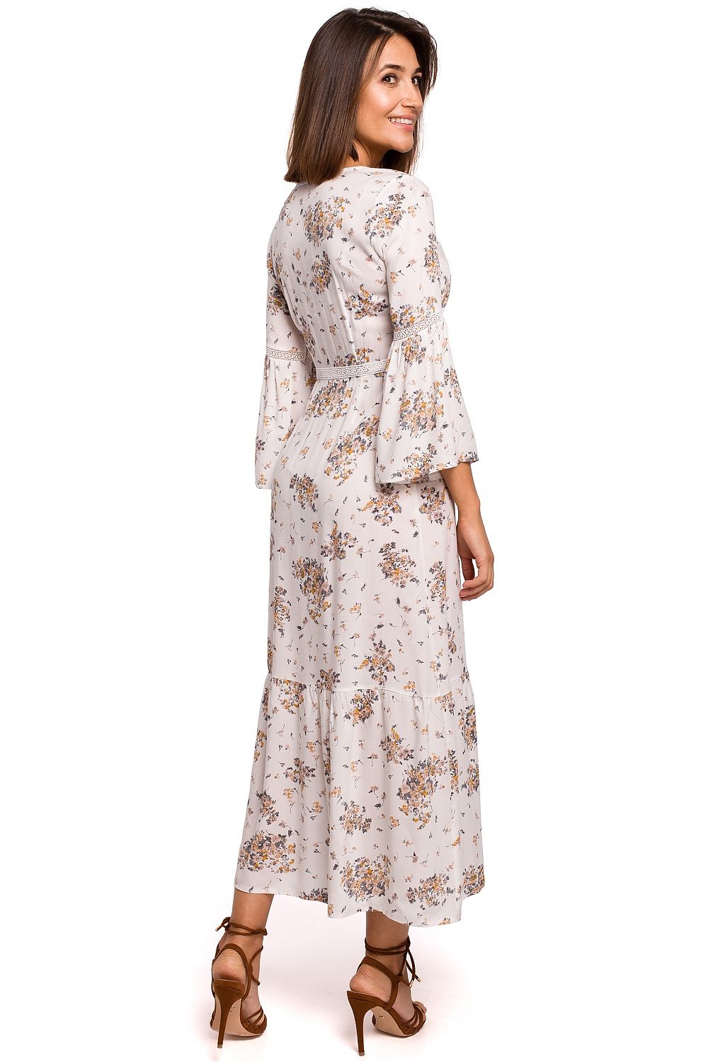 Woman wearing a floral dress on a white background