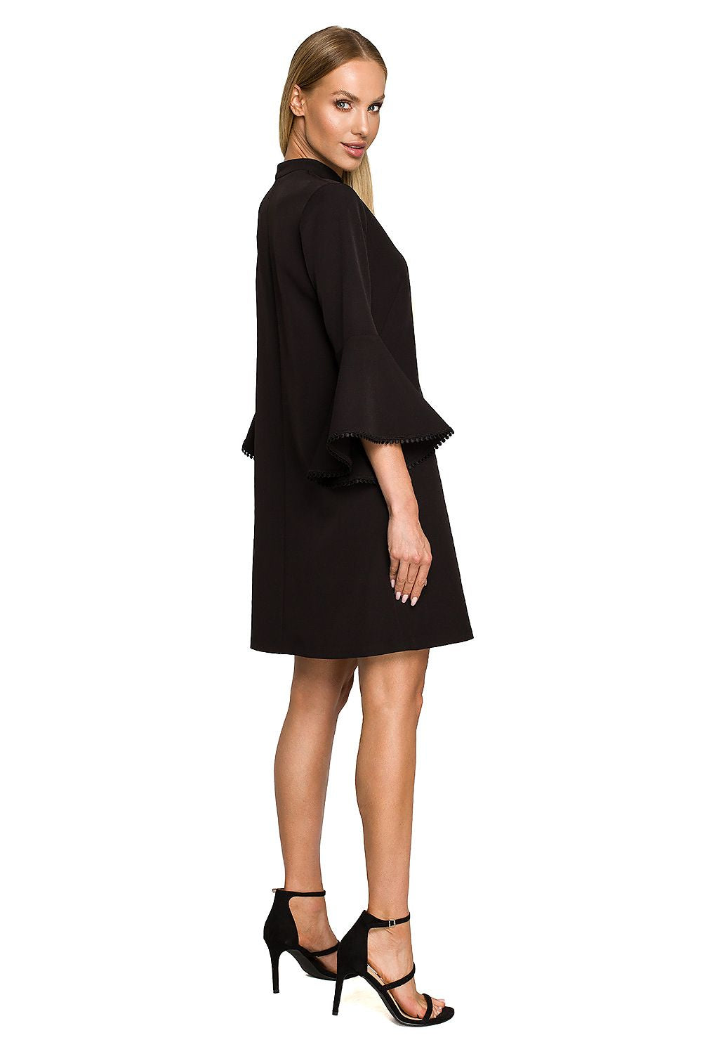 Woman wearing a black dress on a white background