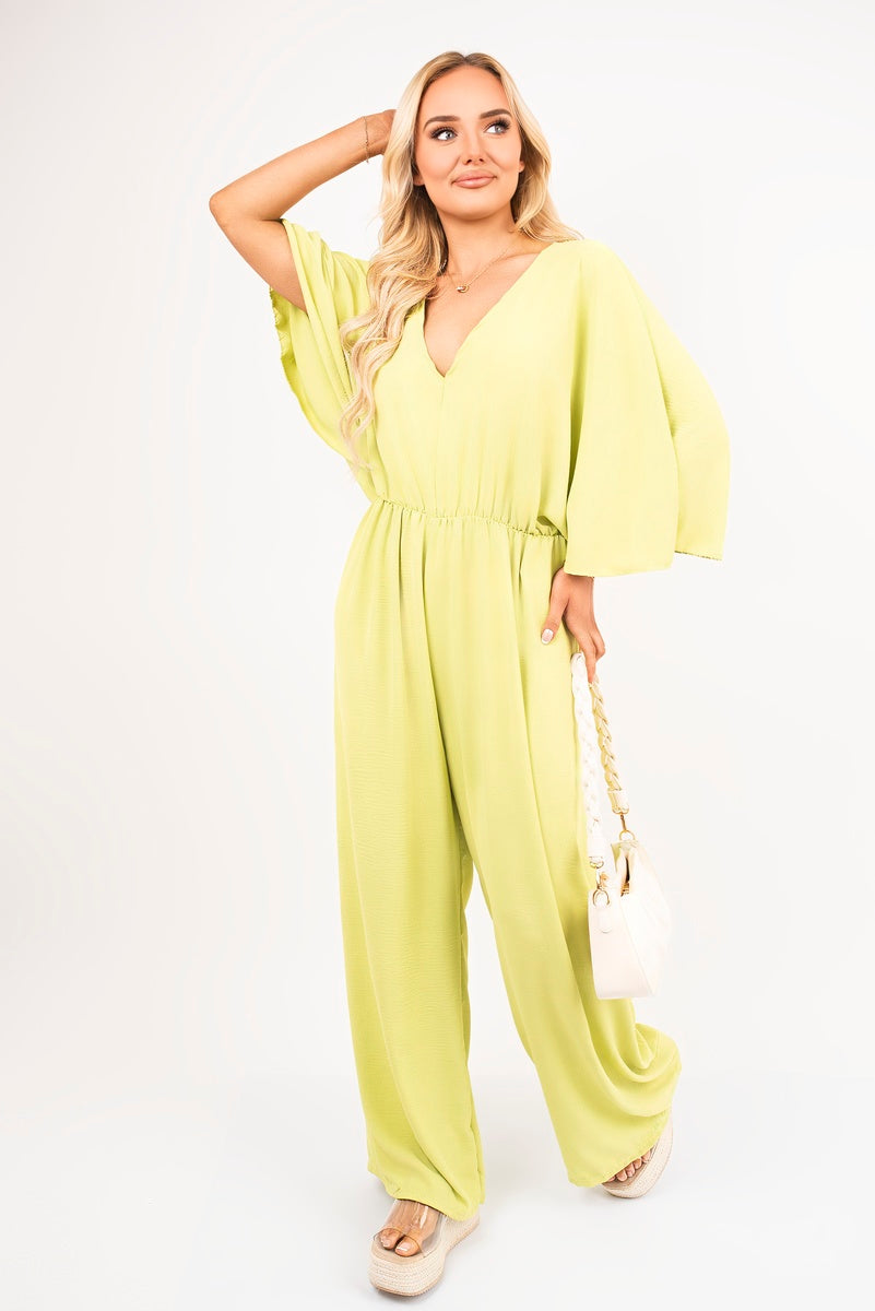 Avocado: “Wide leg V-neck jumpsuit in avocado with back tie detail, side view”