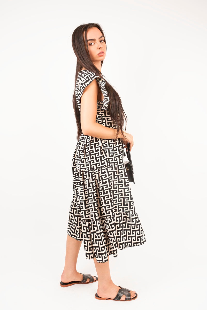 “Geo printed short sleeve tiered midi dress with waist tie, side view”