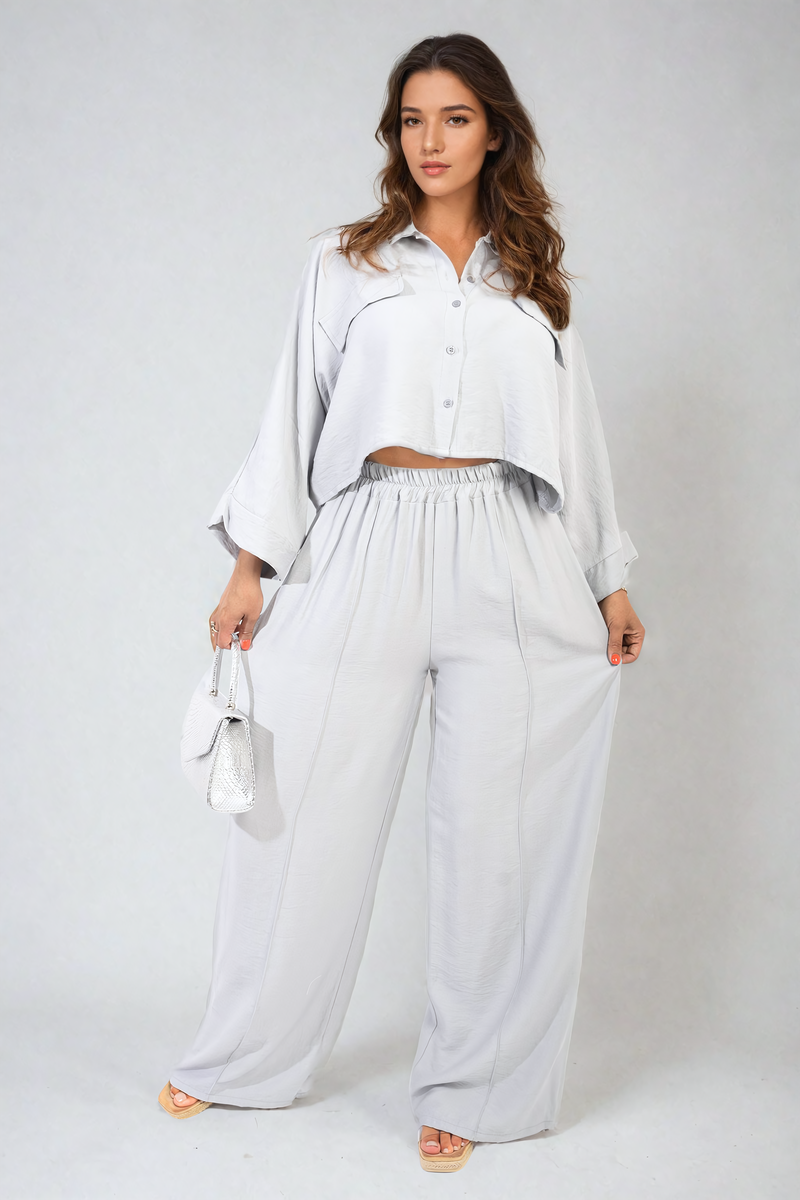 Front view of grey oversized crop top & wide-leg trousers co-ord set.