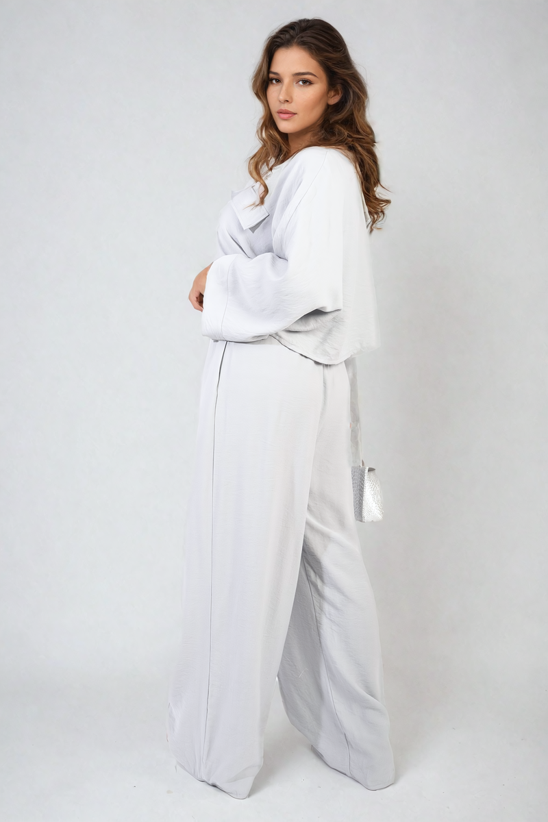 Back view of grey crop top & trousers set.