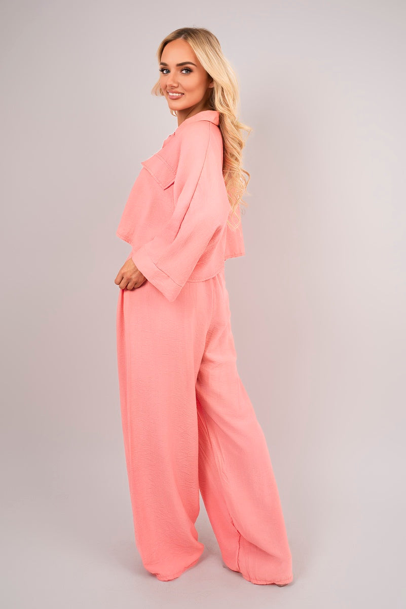 Back view of coral crop top & trousers set.