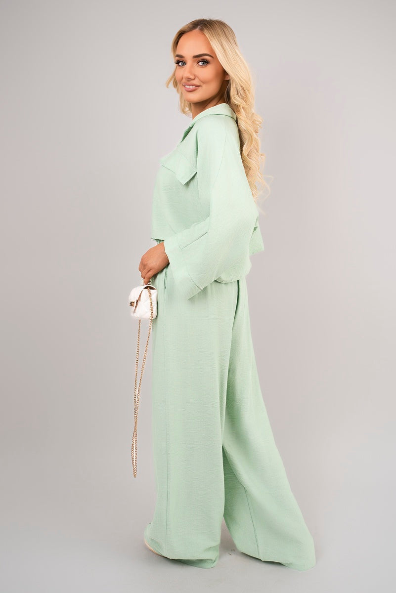 Back view of mint crop top & trousers set.