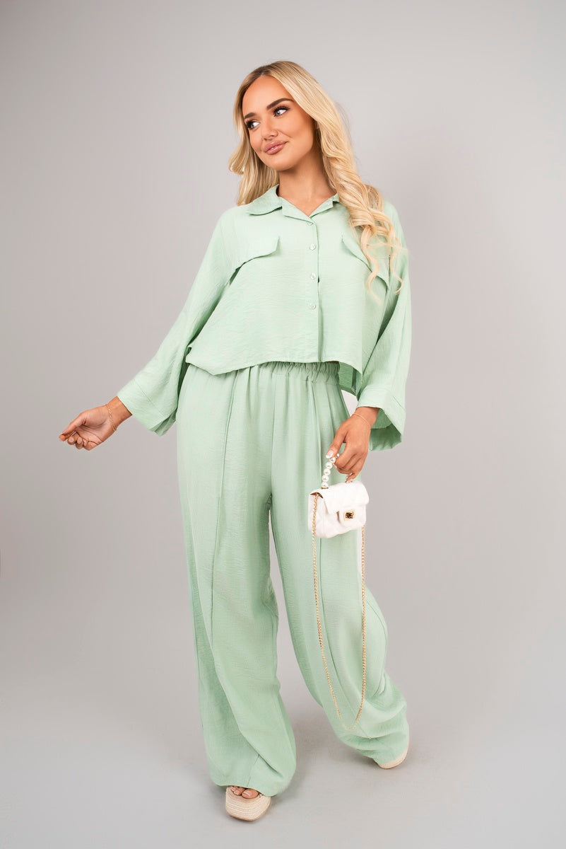 Front view of mint oversized crop top & wide-leg trousers co-ord set.