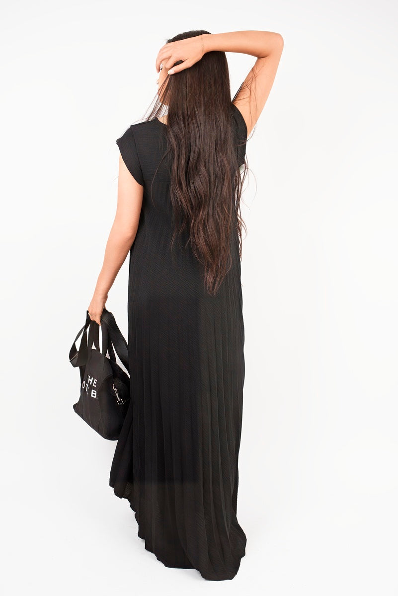 “Black pleated cap sleeve maxi dress, back view”