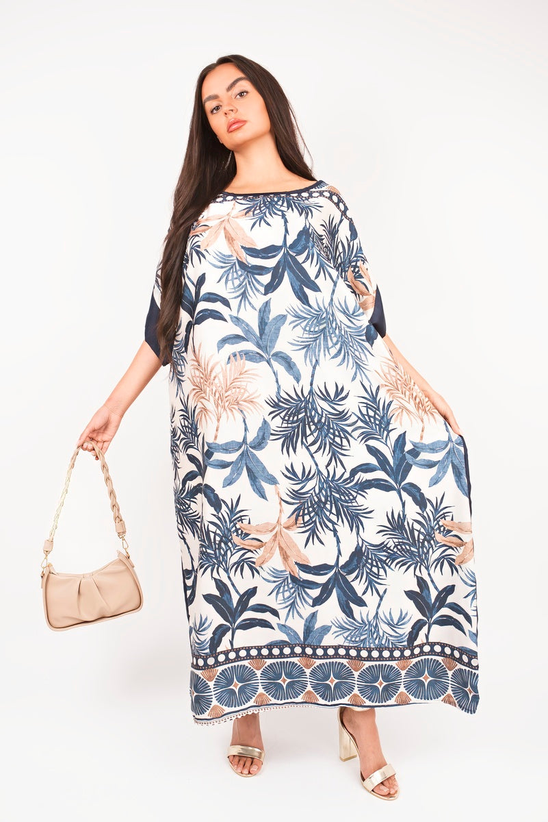 “Navy oversized batwing maxi dress with tropical print, detailed view”