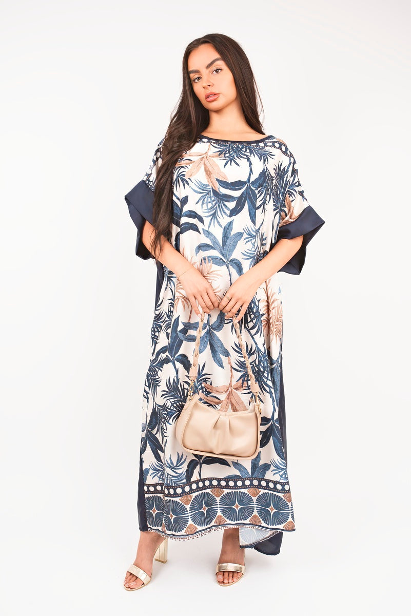 “Navy oversized batwing maxi dress with tropical print, front view”