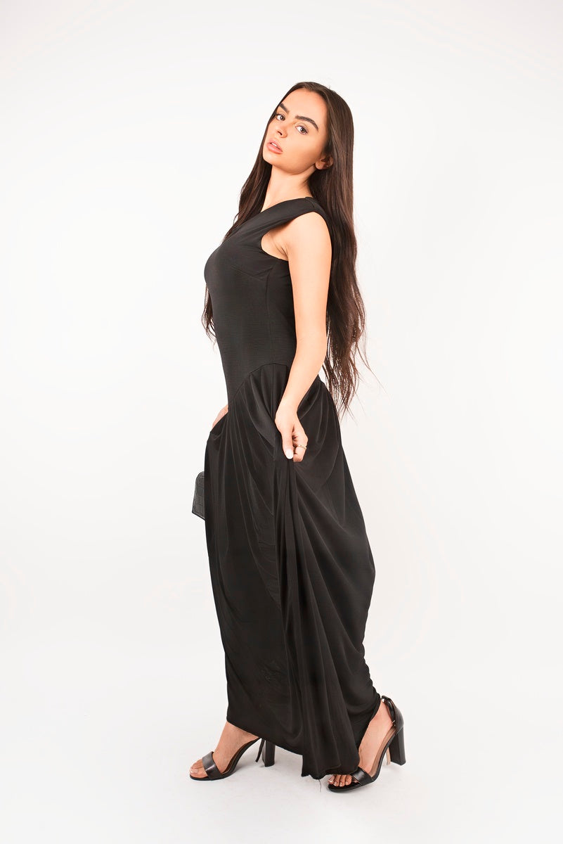 “Black short sleeve pleated maxi dress, side view”